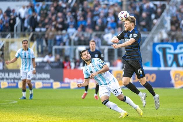 Raphael Schifferl 37 TSV 1860 Muenchen in duel with Steffen Meuer 18 MSV Duisburg , Header, TSV 1860 Muenchen vs MSV Duisburg, 3 Liga, 11 Matchday, 19 10 2025 DFB regulations prohibit any use of photographs as image sequences and or quasi video Muenchen Bayern Germany Copyright: xkolbert-press UlrichxGamelx