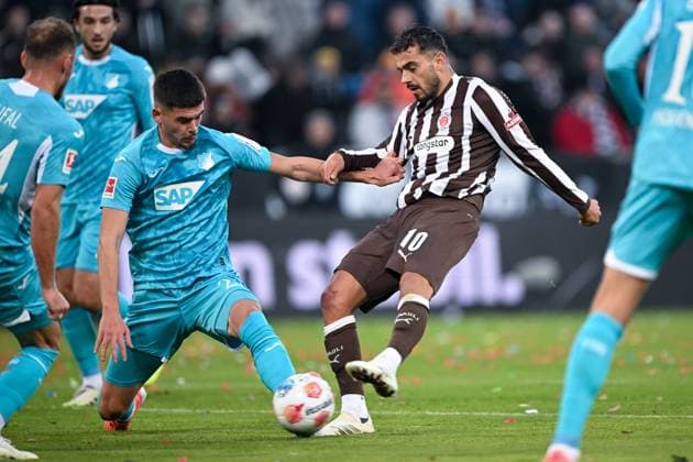 Soccer 1 Bundesliga FC St Pauli TSG Hoffenheim on 19 10 2025 at Millerntor Stadium in Hamburg Danel Sinani St Pauli in a duel against Robin Hranac Hoffenheim MT