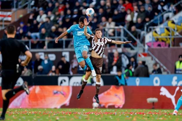 Hamburg, 19 October 2025 Football, 1 Bundesliga 2025 26, FC St Pauli TSG 1899 Hoffenheim Bernardo Fernandes da Silva Junior TSG 1899 Hoffenheim, 13 , Martijn Kaars FC St Pauli, 19 DFL REGULATIONS PROHIBIT ANY USE OF PHOTOGRAPHS AS IMAGE SEQUENCES AND OR QUASI VIDEO