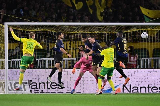 FOOTBALL : Nantes vs Lille - Ligue 1 - 19 10 2025 Thomas Meunier ( 12 - Lille ) , Chancel Mbemba ( 18 - Lille ) and Chidozie Collins Awaziem ( 6 - Nantes ) during the Ligue 1match between FC Nantes and Lille OSC at Stade de la Beaujoire on October 19, 2025 in Nantes, France. ( Photo by Federico Pestellini PsnewZ ) - NantesFrance  Copyright: xFedericoxPestellinix