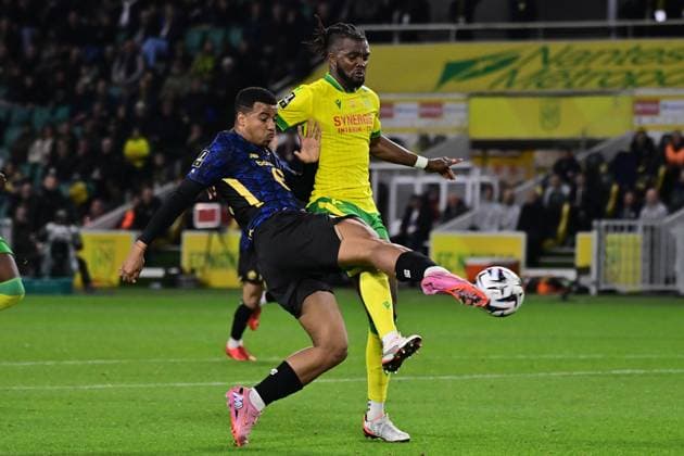 FOOTBALL : Nantes vs Lille - Ligue 1 - 19 10 2025 Hamza Igmane ( 29 - Lille ) and Chidozie Collins Awaziem ( 6 - Nantes ) during the Ligue 1match between FC Nantes and Lille OSC at Stade de la Beaujoire on October 19, 2025 in Nantes, France. ( Photo by Federico Pestellini PsnewZ ) - NantesFrance  Copyright: xFedericoxPestellinix