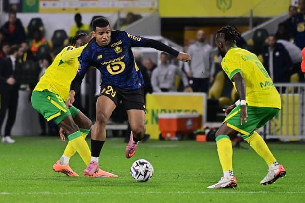 FOOTBALL : Nantes vs Lille - Ligue 1 - 19 10 2025 Hamza Igmane ( 29 - Lille ) and Chidozie Collins Awaziem ( 6 - Nantes ) during the Ligue 1match between FC Nantes and Lille OSC at Stade de la Beaujoire on October 19, 2025 in Nantes, France. ( Photo by Federico Pestellini PsnewZ ) - NantesFrance  Copyright: xFedericoxPestellinix