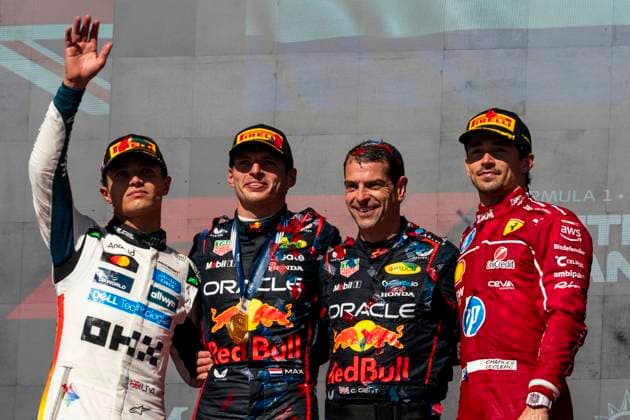 British Formula One driver Lando Norris of McLaren F1 Team, Dutch Formula One driver Max Verstappen of Red Bull Racing, Red Bull Racing mechanic Chris Gent and Monaco s Formula One driver Charles Leclerc of Scuderia Ferrari pose for a photo on the podium following the Formula One United States Grand Prix at the Circuit of the Americas in Austin, Texas on Sunday, October 19, 2025.  AUS2025101951 GREGxNASH