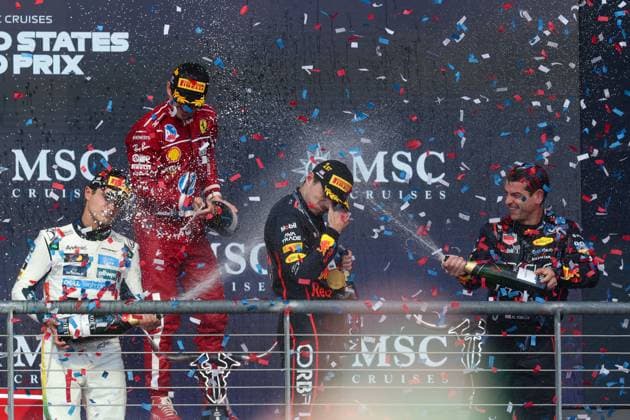AUSTIN, TX - OCTOBER 19: Oracle Red Bull Racing driver Max Verstappen (1) of the Netherlands is sprayed with Champagne by Oracle Red Bull Racing mechanic Chris Gent after the Formula 1 MSC Cruises United States Grand Prix on October 19, 2025, at Circuit of The Americas in Austin, Texas. (Photo by David Buono Icon Sportswire) AUTO: OCT 19 F1 United States Grand Prix EDITORIAL USE ONLY Icon2510190301