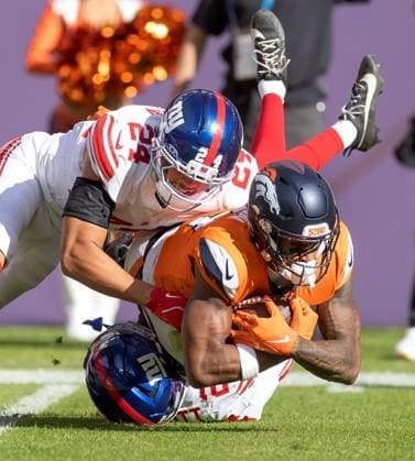 October 19, 2025, Denver, Colorado, USA: Broncos WR COURTLAND SUTTON makes a tough catch in traffic during the 2nd. Half at Empower Field at Mile High Sunday afternoon. Broncos beat the Giants 33-32. Denver USA - ZUMAav4_ 20251019_zaf_av4_001 Copyright: xHectorxAcevedox