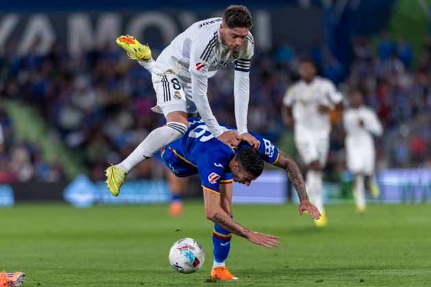 October 20, 2025, Madrid, Madrid, Spain: FEDERICO VALVERDE of Real Madrid CF fights the ball against DIEGO RICO of Getafe CF during the match belonging to the 25 26 season of La Liga EA soccer Ã¢â‚¬oe GETAFE CF vs. REAL MADRID CF Ã¢â‚¬Â held on October 19, 2025, at the Coliseum Stadiumo, Madrid, Spain. Madrid Spain - ZUMAc312 20251020_zsp_c312_101 Copyright: xOscarxManuelxSanchezx