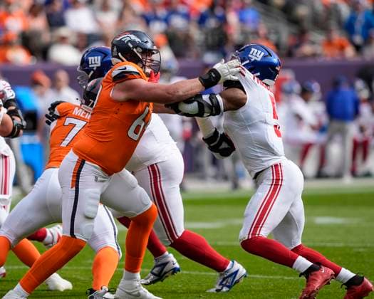 October 19, 2025: Denver Broncos offensive tackle Mike McGlinchey (69) battles New York Giants linebacker Kayvon Thibodeaux (5) in the first half of the football game between the Denver Broncos and New York Giants. CSM. - ZUMAc04_ 20251019_zma_c04_260 Copyright: xDerekxRegensburgerx
