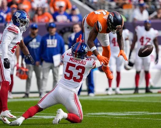 October 19, 2025: New York Giants linebacker Darius Muasau (53) breaks up a pass intended for Denver Broncos wide receiver Courtland Sutton (14) in the first half of the football game between the Denver Broncos and New York Giants. CSM. - ZUMAc04_ 20251019_zma_c04_270 Copyright: xDerekxRegensburgerx