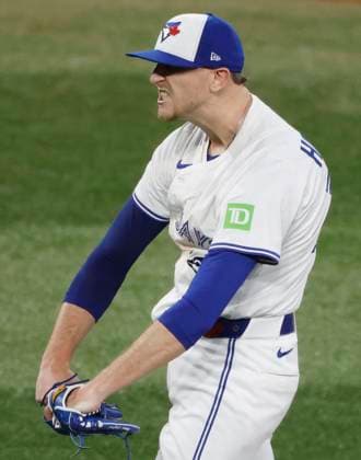 Toronto Blue Jays closing pitcher Jeff Hoffman celebrates after the Blue Jays beat the Seattle Mariners 6-2 in game six of the MLB, Baseball Herren, USA American League Championship Series at Rogers Centre in Toronto, Canada, on Sunday, October 19, 2025. The best-of-seven series is tied 3-3.  TOR20251019942 JOHNxANGELILLO