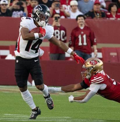 Atlanta Falcons wide receiver Jamal Agnew (14) fends off a 49er defender in ther first quarter at Levi s Stadium in Santa Clara, California on Sunday, October 19, 2025. The 49ers deafeated the Falcons 20-10.  SXP2025101905 TERRYxSCHMITT