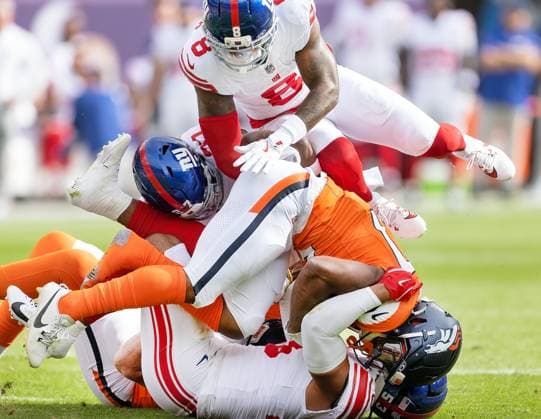 October 19, 2025, Denver, Colorado, USA: Broncos RB J.K. DOBBINS runs into a tough Giants Defense during the 1st. Half at Empower Field at Mile High Sunday afternoon. Broncos beat the Giants 33-32. Denver USA - ZUMAav4_ 20251019_zaf_av4_017 Copyright: xHectorxAcevedox