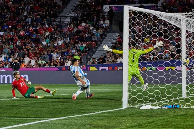 (251020) -- SANTIAGO, Oct. 20, 2025 -- Yassir Zabiri (L) of Morocco scores a goal during the final match between Argentina and Morocco at the FIFA U-20 World Cup Chile 2025 in Santiago, Chile, Oct. 19, 2025. ) (SP)CHILE-SANTIAGO-FOOTBALL-FIFA U20 WORLD CUP-FINAL MengxDingbo 
