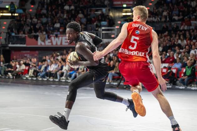 Njie B 13 Loewen Braunschweig in a duel with Niels Giffey 5 FC Bayern Basketball , FC Bayern Basketball vs Basketball Loewen Braunschweig, BBL Cup, Round of 16, 20 10 2025 Munich Bavaria Germany Copyright: xkolbert-press UlrichxGamelx