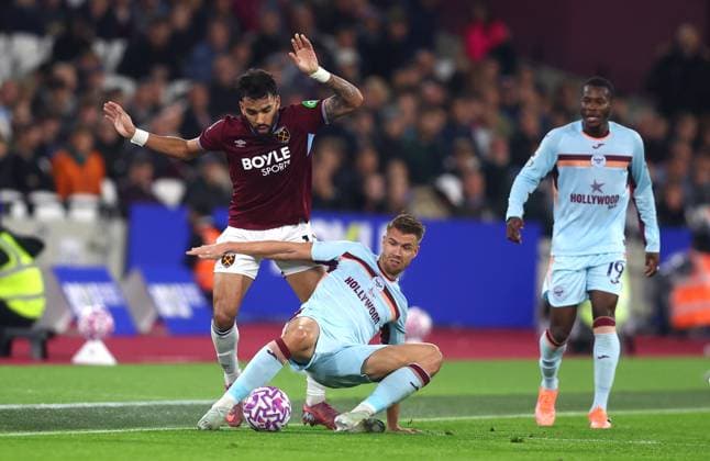 London, England, 20th October 2025. Lucas Paqueta of West Ham and Kristoffer Ajer of Brentford challenge for the ball during the West Ham United vs Brentford Premier League match at the London Stadium, London. Picture credit should read: Paul Terry Sportimage EDITORIAL USE ONLY. No use with unauthorised audio, video, data, fixture lists, club league logos or live services. Online in-match use limited to 120 images, no video emulation. No use in betting, games or single club league player publications. SPI_022_PT_West_Ham_Brentford SPI-4226-0022