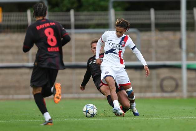 Zayon ChtaÃ¯-Telamio (FC Paris Saint-Germain U19) und Julien Kurowski (Bayer Leverkusen U19) battle for the ball during the UEFA Youth League 2025 26 match between Bayer 04 Leverkusen and Paris Saint-Germain on October 21, 2025 in Leverkusen, Germany. (Photo by Oliver Kaelke DeFodi Images)