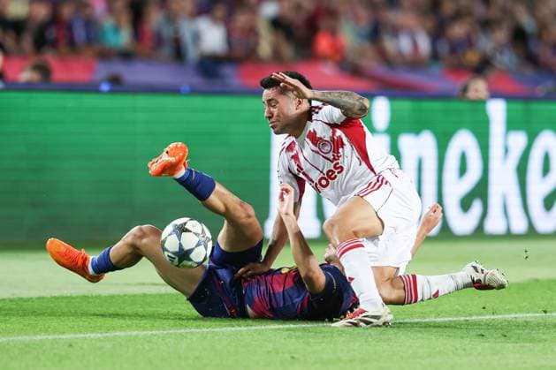 October 21, 2025, Barcelona, Barcelona, SPAIN: Fermin Lopez of FC Barcelona, Barca and Francisco Ortega of Olympiacos FC in action during the UEFA Champions League 2025 26 League Phase MD3 match between FC Barcelona and Olympiacos FC at Estadi Olimpic Lluis Companys on October 21, 2025 in Barcelona, Spain. Barcelona SPAIN - ZUMAa181 20251021_zaa_a181_147 Copyright: xIrinaxR.xHipolitox