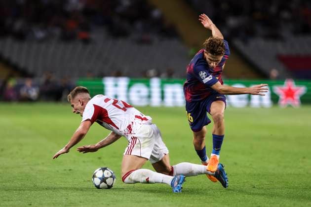 October 21, 2025, Barcelona, Barcelona, SPAIN: Costinha of Olympiacos FC and Fermin Lopez of FC Barcelona, Barca compete for the ball during the UEFA Champions League 2025 26 League Phase MD3 match between FC Barcelona and Olympiacos FC at Estadi Olimpic Lluis Companys on October 21, 2025 in Barcelona, Spain. Barcelona SPAIN - ZUMAa181 20251021_zaa_a181_153 Copyright: xJavierxBorregox