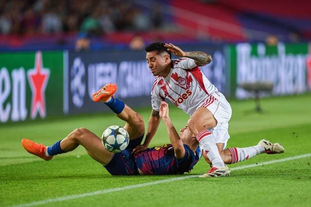 FC Barcelona, Barca v OLIMPIACOS FC OLIMPIC STADIUM LLUIS COMPANYS. MONTJUIC,BARCELONA. October 21,2025 FC BARCELONA vs OLIMPIACOS FC October 21,2025 Fermin Lopez (16) of FC Barcelona vies with Francisco Ortega (3) of Olimpiacos FC during the soccer match corresponding to the third match of the group stage of the UEFA Champions League between FC Barcelona and Olimpiacos FC at Olimpic Stadium Lluis Companys of MontjuÃ¯c in Barcelona, Spain. Barcelona ESP Copyright: xS.xRosx