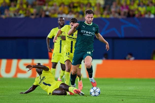Villarreal CF v Manchester City - UEFA Champions League 2025 26 League Phase MD3 VILLARREAL, SPAIN - OCTOBER 21: Nico Gonzalez of Manchester City competes for the ball with Pape Gueye Left-Back of Villarreal CF during the UEFA Champions League 2025 26 League Phase MD3 match between Villarreal CF and Manchester City at Estadio de la Ceramica on October 21, 2025 in Villarreal, Spain. (Photo by Jose Torres Photo Players Images Magara Press) Villarreal Estadio de la Ceramica Spain Copyright: xJosexTorresx