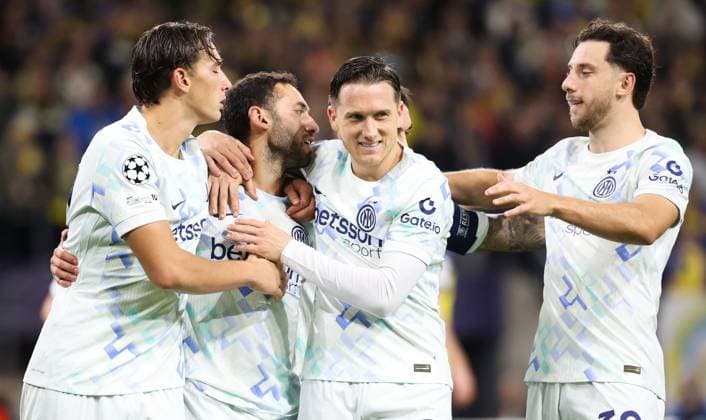 Inter s Hakan Calhanoglu celebrates after scoring during a soccer game between Belgian Royale Union Saint-Gilloise and Italian Internazionale Milano, Tuesday 21 October 2025 in Brussels, on the third day of the League phase of the UEFA Champions League tournament. VIRGINIExLEFOUR  x137539547x
