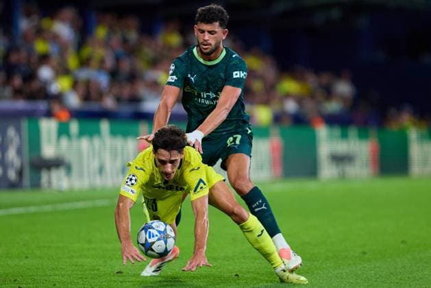 Villarreal CF v Manchester City - UEFA Champions League 2025 26 League Phase MD3 VILLARREAL, SPAIN - OCTOBER 21: Matheus Nunes of Manchester City competes for the ball with Sergi Cardona Centre-Back of Villarreal CF during the UEFA Champions League 2025 26 League Phase MD3 match between Villarreal CF and Manchester City at Estadio de la Ceramica on October 21, 2025 in Villarreal, Spain. (Photo by Jose Torres Photo Players Images Magara Press) Villarreal Estadio de la Ceramica Spain Copyright: xJosexTorresx