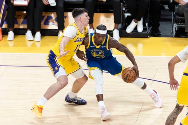 October 21, 2025, Los Angeles, California, United States: Golden State Warriors™ Jimmy Butler III 10 is defended by Los Angeles Lakers™ Jake LaRavia 12 during an NBA, Basketball Herren, USA basketball game at Crypto.com Arena. Final score; Warriors 119:109 Lakers Los Angeles United States - ZUMAs197 20251021_aaa_s197_552 Copyright: xRingoxChiux