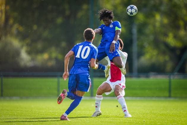 SURREY , 22-10-2025 , Chelsea Football Club Training Ground , season 2025 2026 , UEFA Youth League football , League phase Matchday 3 , match between Chelsea and Ajax , picture shows Ajax player Aaron Bouwman and Chelsea player Shumaira Mheuka Chelsea - Ajax (Youth League)  x31639328x Copyright: