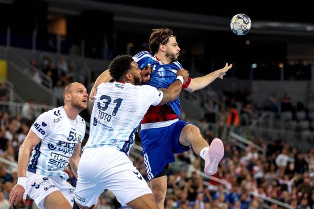 HC Zagreb v OTP Bank Pick Szeged: EHF Champions League Filip Glavas of HC Zagreb plays a ball whilst under pressure from during the Men s EHF Champions League group B match between HC Zagreb and OTP Bank Pick Szeged at Arena Zagreb on October 22, 2025. in Zagreb, Croatia.  IgorxKralj PIXSELL