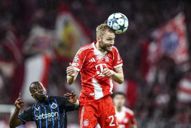 Club s Carlos Forbs and Bayern s Konrad Laimer fight for the ball during a game between German club FC Bayern Munchen and Belgian soccer team Club Brugge, on Wednesday 22 October 2025 in Munich, Germany, on day three of the League phase of the UEFA Champions League tournament. BRUNOxFAHY  x137624484x