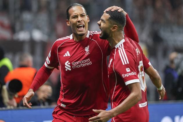 Eintracht Frankfurt FC Liverpool, UEFA Champions League Virgil van Dijk Liverpool FC, 4 and Cody Gakpo Liverpool FC, 18 cheer after scoring the UEFA Champions League matchday 3 goal between Eintracht Frankfurt and Liverpool FC on October 22, 2025 at Deutsche Bank Park in Frankfurt am Main , Frankfurt am Main Hessen Germany Deutsche Bank Park