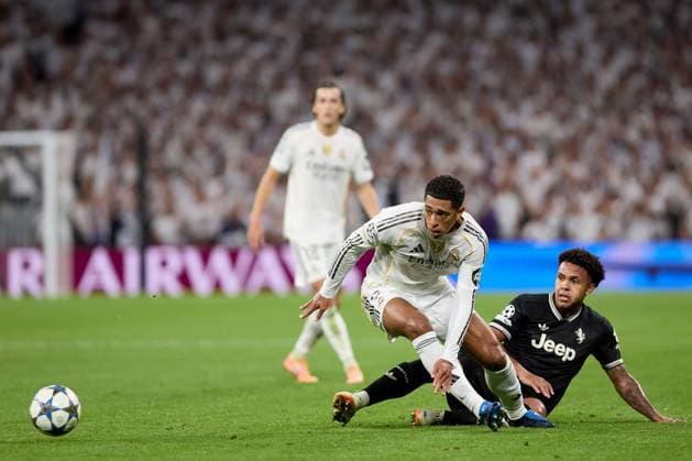 Jude Bellingham of Real Madrid CF and Weston Mckennie of Juventus FC Real Madrid v Juventus, UEFA Champions League, Football, Estadio Santiago Bernabeu, Madrid, Spain - 22 Oct 2025Madrid Estadio Santiago Bernabu Spain EDITORIAL USE ONLY No use with unauthorised audio, video, data, fixture lists, club league logos or live services. Online in-match use limited to 120 images, no video emulation. No use in betting, games or single club league player publications.  Copyright: xRubenxAlbarran Shutterstockx 15564869aq