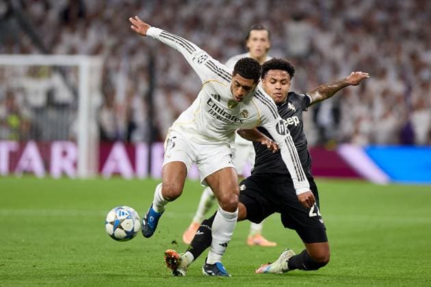 Jude Bellingham of Real Madrid CF and Weston Mckennie of Juventus FC Real Madrid v Juventus, UEFA Champions League, Football, Estadio Santiago Bernabeu, Madrid, Spain - 22 Oct 2025Madrid Estadio Santiago Bernabu Spain EDITORIAL USE ONLY No use with unauthorised audio, video, data, fixture lists, club league logos or live services. Online in-match use limited to 120 images, no video emulation. No use in betting, games or single club league player publications.  Copyright: xRubenxAlbarran Shutterstockx 15564869at