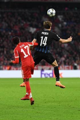 Michael Olise 17 Bayern and Bjorn Meijer 14 Bruges in action during the Champions League match FC Bayern Munich Club Brugge on 22 10 2025 Munich Allianz Arena Bayern Germany