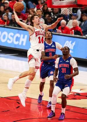(251023) -- CHICAGO, Oct. 23, 2025 -- Chicago Bulls Matas Buzelis (L) rises to dunk the ball during the NBA, Basketball Herren, USA regular season basketball game between Detroit Pistons and Chicago Bulls at the United Center in Chicago, the United States, on Oct. 22, 2025. (Photo by Joel Lerner Xinhua) (SP)U.S.-CHICAGO-BASKETBALL-NBA-CHICAGO BULLS VS DETROIT PISTONS XuxJing 