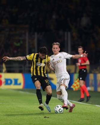 Jesper Karlsson of Aberdeen and Lazaros Rota of AEK AEK Athens v Aberdeen, UEFA Conference League, Group Stage, Football, OPAP Arena, Athens, Greece - 23 Oct 2025Athens OPAP Arena Greece EDITORIAL USE ONLY No use with unauthorised audio, video, data, fixture lists, club league logos or live services. Online in-match use limited to 120 images, no video emulation. No use in betting, games or single club league player publications. Copyright: xCostasxBaltas Shutterstockx 15567740af