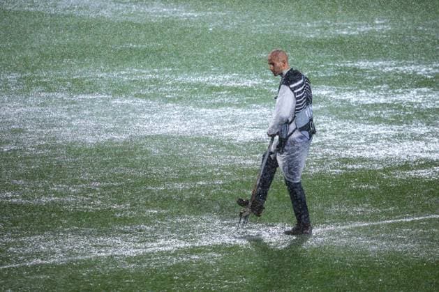 HNK Rijeka v AC Sparta Praha: UEFA Conference League A groundsmen attempts to release water from the waterlogged pitch after play is suspended due to heavy rain during the UEFA Conference League group phase matchday 2 between HNK Rijeka and AC Sparta Praha at HNK Rijeka Stadium on October 23, 2025. in Rijeka, Croatia.  NelxPavletic PIXSELL