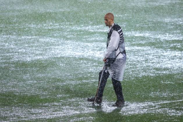 HNK Rijeka v AC Sparta Praha: UEFA Conference League A groundsmen attempts to release water from the waterlogged pitch after play is suspended due to heavy rain during the UEFA Conference League group phase matchday 2 between HNK Rijeka and AC Sparta Praha at HNK Rijeka Stadium on October 23, 2025. in Rijeka, Croatia.  NelxPavletic PIXSELL
