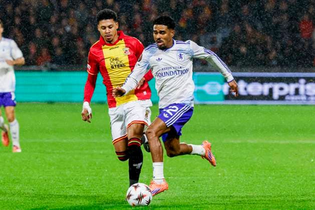 Ian Maatsen of Aston Villa FC dribbles with the ball under pressure from Richonell Margaret of Go Ahead Eagles Go Ahead Eagles v Aston Villa FC, UEFA Europa League 2025 26 League Phase MD3, Go Ahead Eagles v Aston Villa FC, Stadion De Adelaarshorst, October 23, 2025, Deventer, Netherlands.