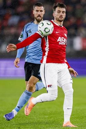ALKMAAR , 23-10-2025 , AFAS Stadium , season 2025 2026 , UEFA Conference League football , League phase matchday 2 , match between AZ and SK Slovan Bratislava , picture shows AZ player Troy Parrott and SK Slovan Bratislava player Kenan Bajric AZ - Slovan Bratislava  x31654849x Copyright: