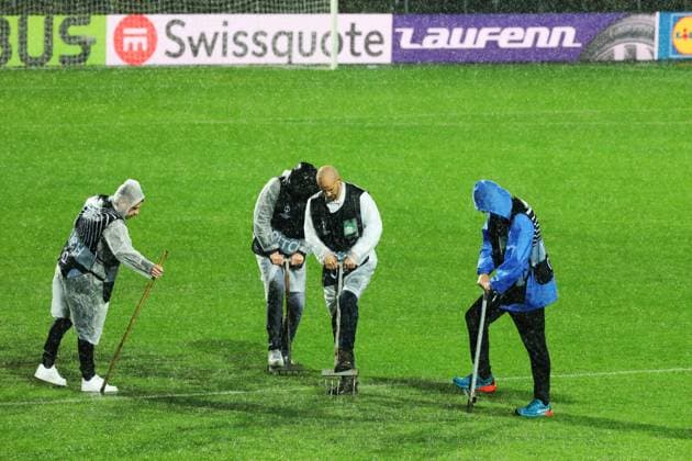 HNK Rijeka v AC Sparta Praha: UEFA Conference League A groundsmen attempts to release water from the waterlogged pitch after play is suspended due to heavy rain during the UEFA Conference League group phase matchday 2 between HNK Rijeka and AC Sparta Praha at HNK Rijeka Stadium on October 23, 2025. in Rijeka, Croatia.  GoranxKovacic PIXSELL