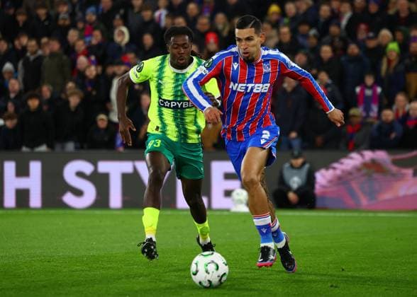London, England, 23rd October 2025. Daniel Munoz of Crystal Palace with the ball ahead of Jeremie Gnali of AEK Larnaca during the Crystal Palace vs AEK Larnaca UEFA Conference League match at Selhurst Park, London. Picture credit should read: Paul Terry Sportimage EDITORIAL USE ONLY. No use with unauthorised audio, video, data, fixture lists, club league logos or live services. Online in-match use limited to 120 images, no video emulation. No use in betting, games or single club league player publications. SPI_019_PT_Crystal_Palace_Larnaca SPI-4231-0019