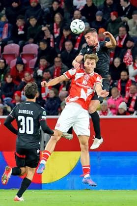 Mainz, Germany October 23, 2025 Conference League 2025 2026 FSV Mainz 05 vs Zrinjski Mostar In the picture from left in the duel Nelson Weiper Mainz against Ilija Masic Zrinjski Mostar Mewa Arena Rheinland Pfalz Copyright: xFotostandx xRacochax