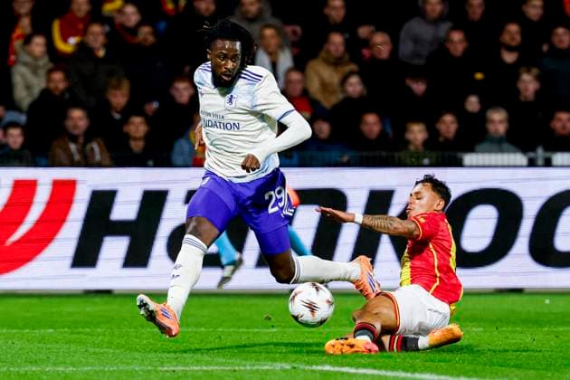 Evann Guessand of Aston Villa FC passes the ball under pressure from Dean James of Go Ahead Eagles Go Ahead Eagles v Aston Villa FC, UEFA Europa League 2025 26 League Phase MD3, Go Ahead Eagles v Aston Villa FC, Stadion De Adelaarshorst, October 23, 2025, Deventer, Netherlands.