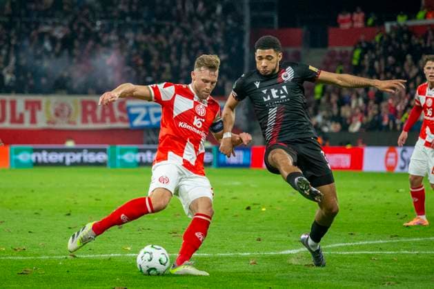 GER, Mainz, Soccer, UEFA Conference League, Matchday 2, FSV Mainz 05 vs HSK Zrinjski Mostar pictured from l Silvan Dominic Widmer FSV Mainz 05 30 , Tyler Burey HSK Zrinjski Mostar 07 , duel 23 10 2025, MEWA Arena Mainz UEFA REGULATIONS PROHIBIT ANY USE OF PHOTOGRAPHS AS IMAGE SEQUENCES AND OR QUASI VIDEO, Copyright: HMBxMedia PaulxFritz