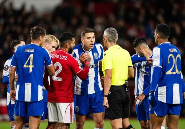 23rd October 2025; The City Ground, Nottingham, England; UEFA Europa League Football, Nottingham Forest versus Porto; Jan Bednarek of FC Porto speaks to Referee Radu Petrescu after the penalty was awarded to Nottingham Forest  GodfreyxPitt