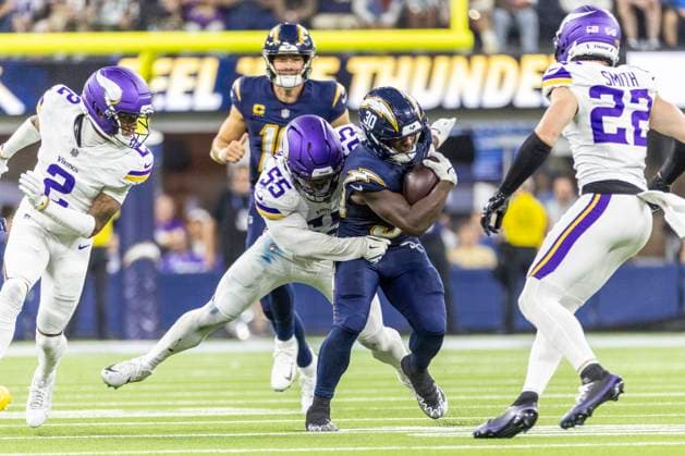 October 23, 2025, Los Angeles, California, USA: Los Angeles Chargers running back Kimani Vidal 30 is tackled by Minnesota Vikings linebacker Eric Wilson 55 during an NFL, American Football Herren, USA football game at SoFi Stadium, Thursday Oct. 23, 2025, in Inglewood, Calif. Los Angeles USA - ZUMAc68_ 20251023_zaf_c68_018 Copyright: xRingoxChiux