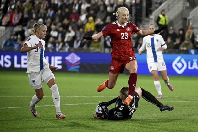 Danish Sofie Svava jumps over her teammate, goalkeeper Freja Thisgaard during women s Nations s League football match Finland vs Denmark in Tampere, Finland on 24th October, 2025. Finnish Emma Koivisto is on the left and Linda Sällström on the right. Tampere Finland LKFTJK20251024192622BZAQ  Copyright: xAnttixAimo-Koivistox LKFTJK20251024192622BZAQ