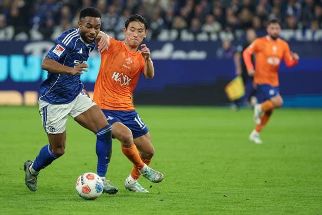 2 Bundesliga FC Schalke 04 SV Darmstadt 98 on 24 10 2025 at the Veltins Arena in Schalke Moussa Sylla Schalke 9 vs Hiroki Akiyama Darmstadt 16 MH