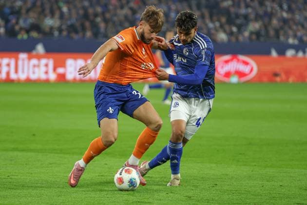 2 Bundesliga FC Schalke 04 SV Darmstadt 98 on 24 10 2025 at the Veltins Arena in Schalke Mertcan Ayhan Schalke 43 vs Killian Corredor Darmstadt 34 MH