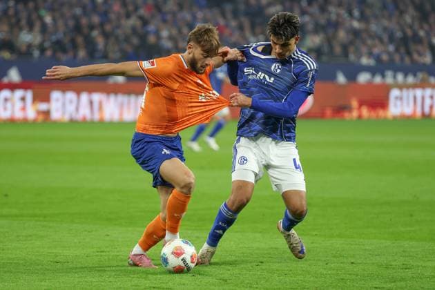 2 Bundesliga FC Schalke 04 SV Darmstadt 98 on 24 10 2025 at the Veltins Arena in Schalke Mertcan Ayhan Schalke 43 vs Killian Corredor Darmstadt 34 MH